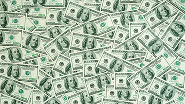 hundred dollar bills layed out.