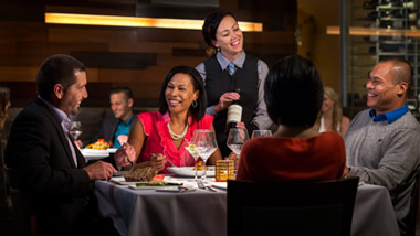 two couples dining at upscale restaurant