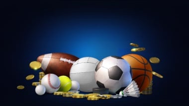 variety of sports balls in a pile