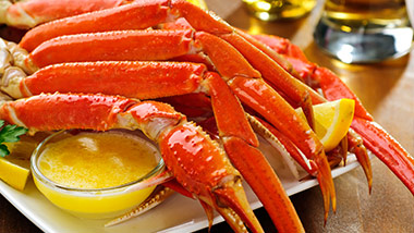plate of crab legs and dish of melted butter
