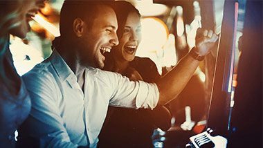 close up of man and woman at slot machine