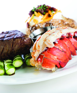 white plate with steak ande lobster tail
